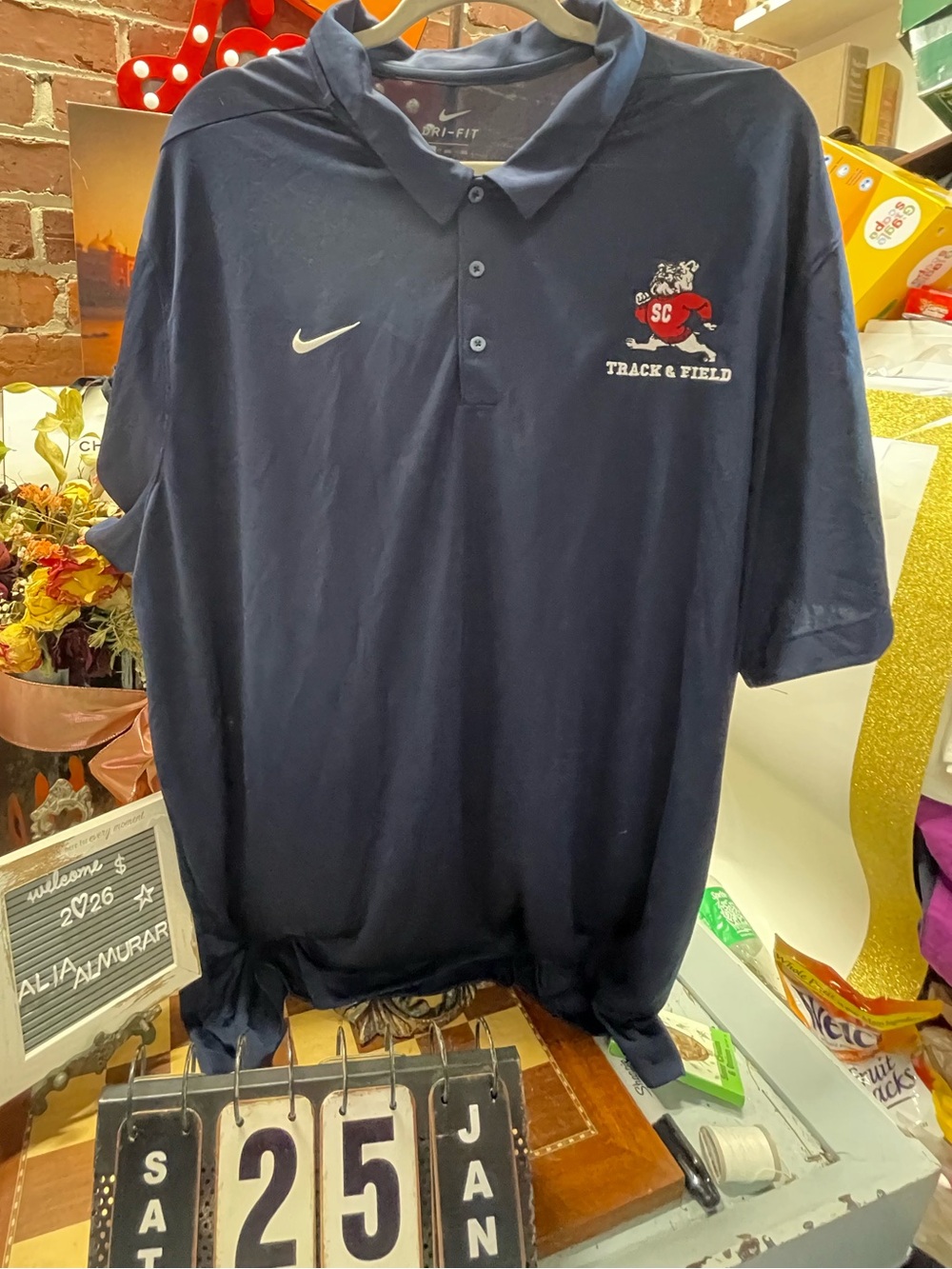 Nike Dri-FIT polo shirt with a Bulldogs "Track & Field" logo on the left chest.